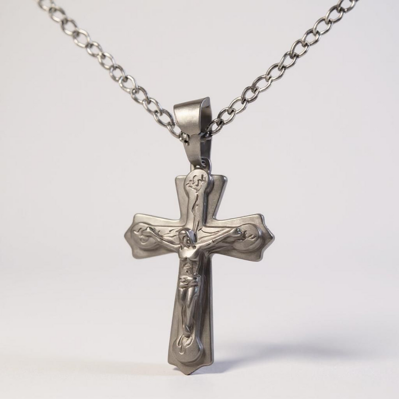 A durable stainless steel, this classic piece features a striking cross pendant, three-layered design adds depth and dimension, while the high-quality metal 