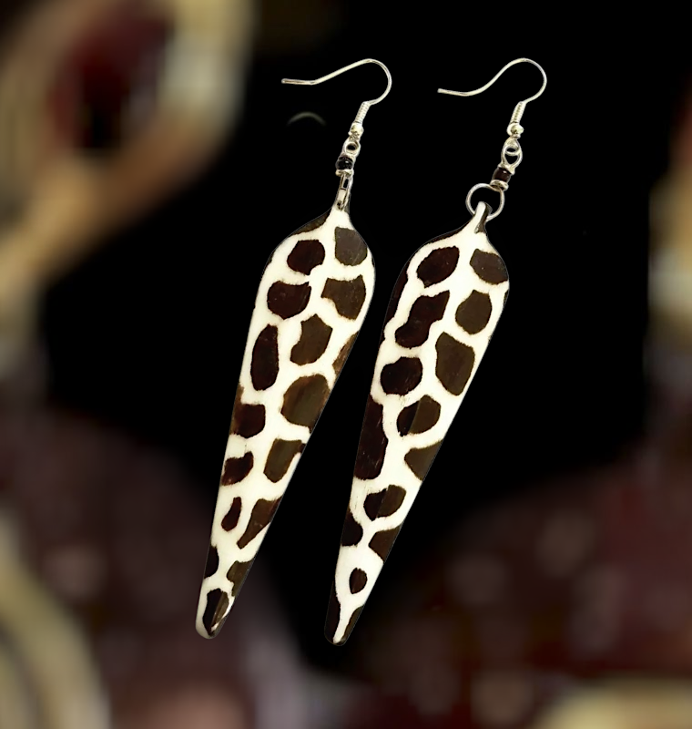  Wild Side Strut Earrings Long giraffe-print earrings hand-carved from cow bone, featuring a 3-inch drop and hook closure