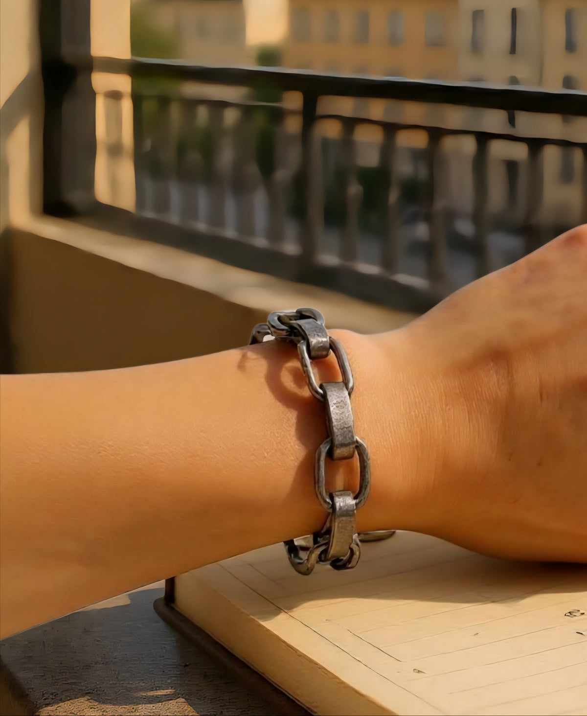 Obsidian Smoke Bracelet with hammered oval chain links in a smoky gunmetal-tone finish, accented by a single crystal detail at the clasp, styled for modern elegance. ZoharasVogue 