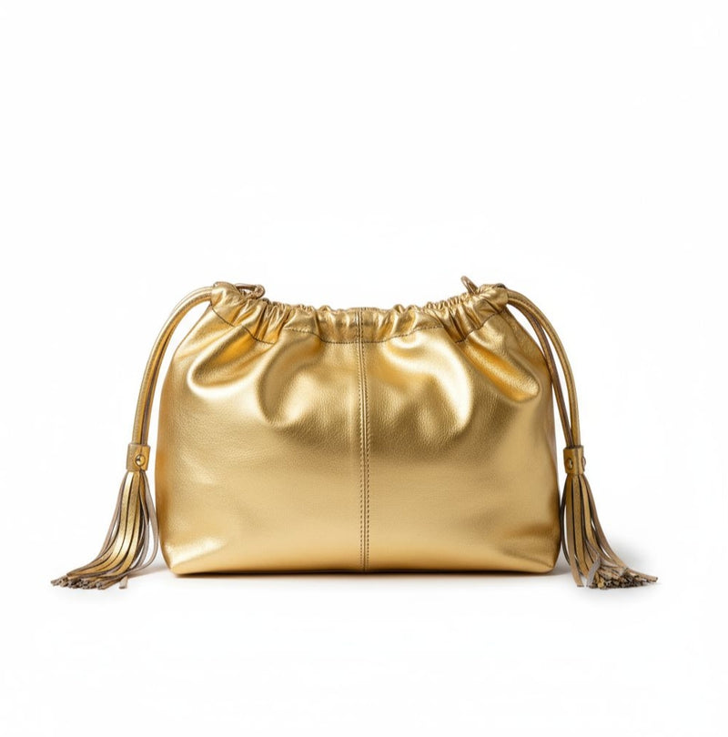 Gold leather drawstring bag with tassels on a white background ZoharasVogue