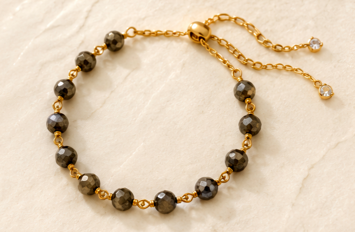 The Eclipse Necklace Handcrafted pyrite gemstone necklace and bracelet featuring faceted rondelle beads, gold chain links, and an open circle pendant in a modern luxury design.- ZOHARAS VOGUE