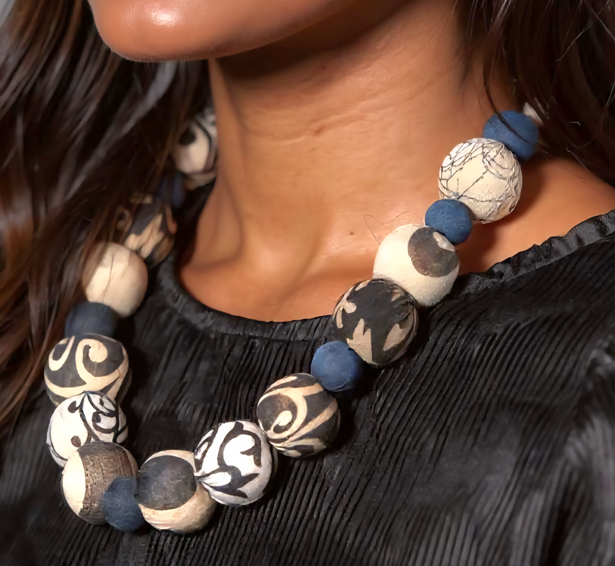 Handmade indigo and black-and-white Kantha beaded necklace with alternating bead sizes and collar-style fit.