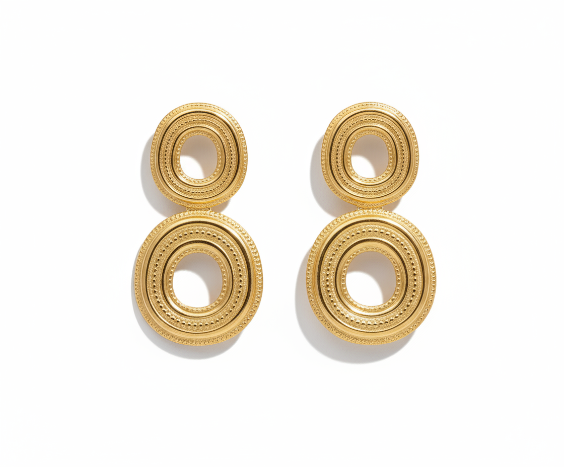 Unspoken Discs Earrings featuring double textured stainless-steel discs in a bold, modern French design for contemporary elegance. ZoharasVogue