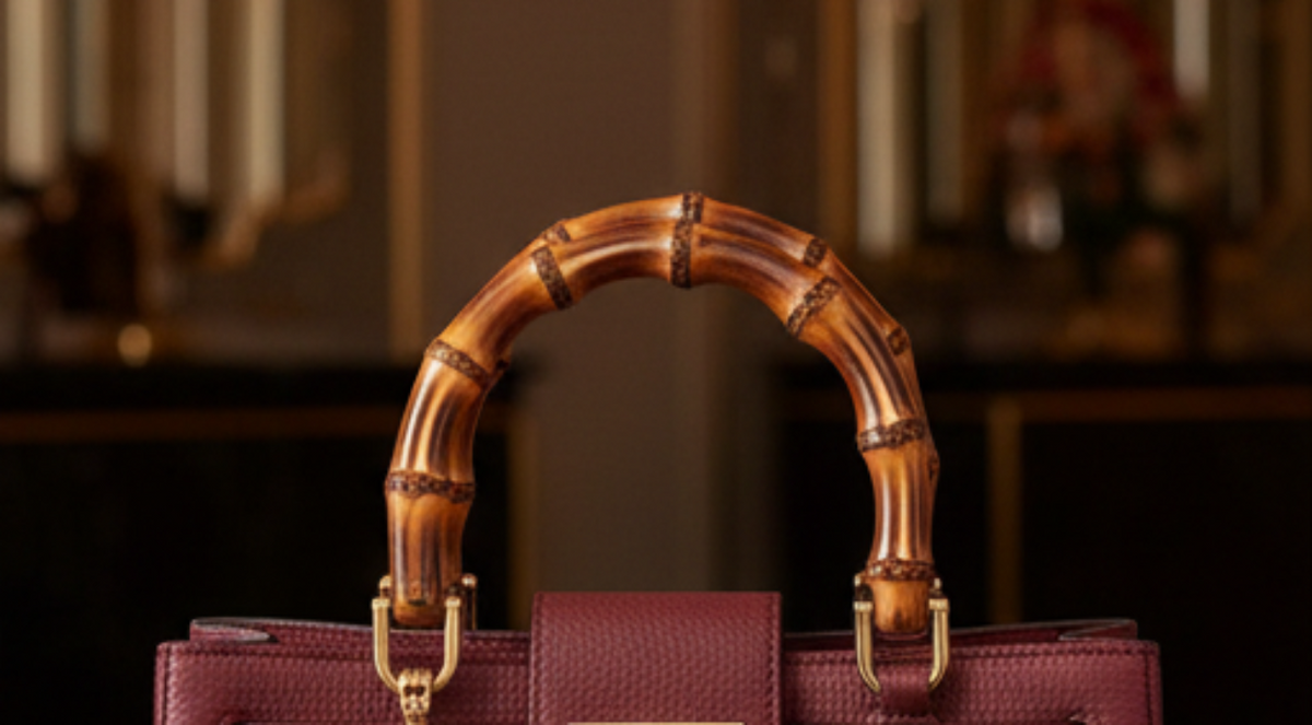 Valencia Rue Bag – handcrafted Italian calfskin leather handbag with bamboo handles, light gold hardware, and bamboo clasp closure, featuring dual compartments and an adjustable shoulder strap for refined everyday elegance.