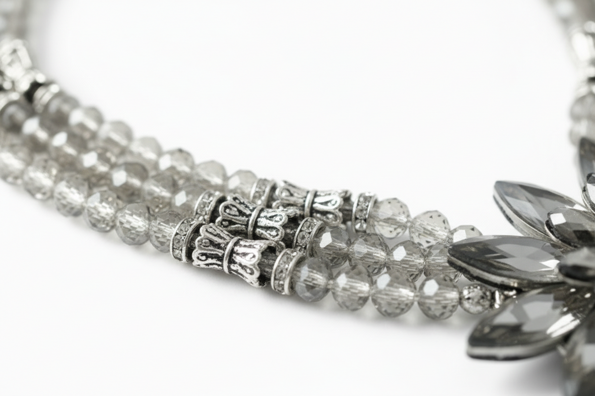 Chunky handmade statement necklace featuring faceted gunmetal silver beads and an oversized silver snowflake pendant with vintage brushed silver hardware and lobster claw clasp.- ZOHARAS VOGUE